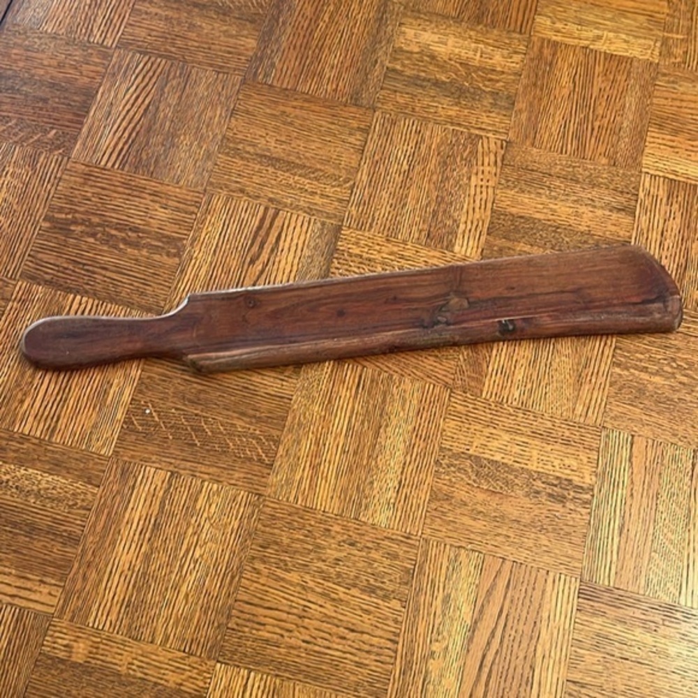 Wooden narrow tray or concave paddle